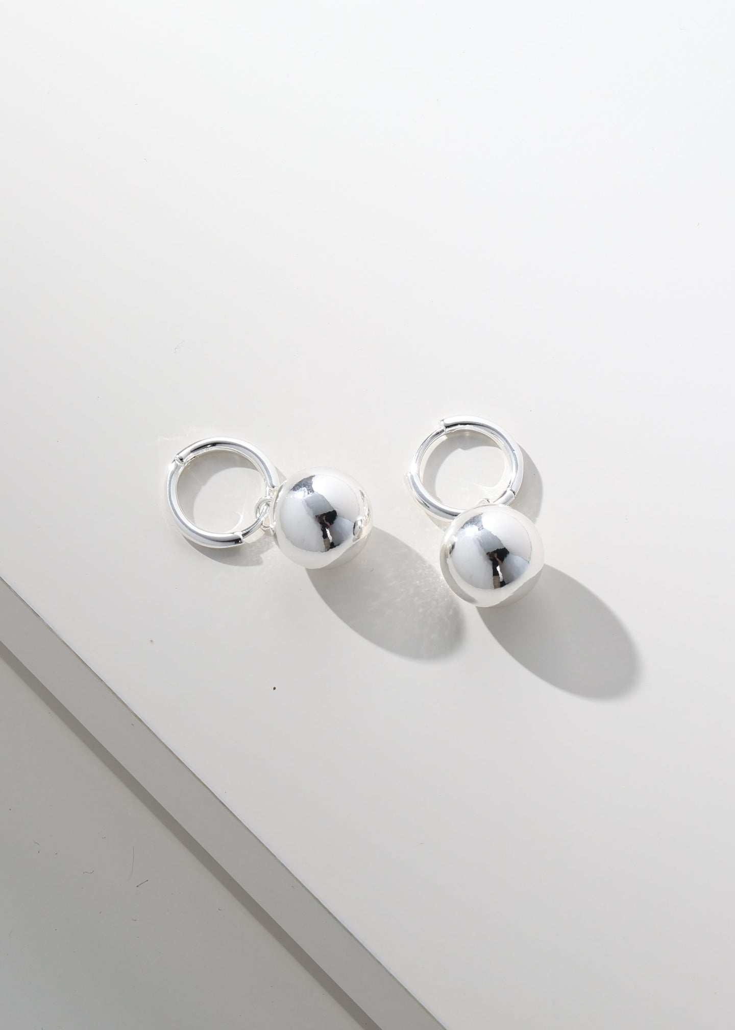Merx - Polished Ball Drop Huggie Earrings Silver
